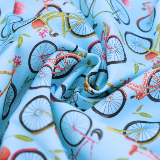 Tessuto in Raso di 100% Cotone: Biciclette su sfondo Celeste