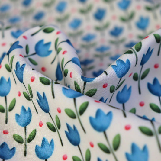 Tessuto SOFTSHELL impermeabile: Tulipani blu su sfondo giallo chiaro