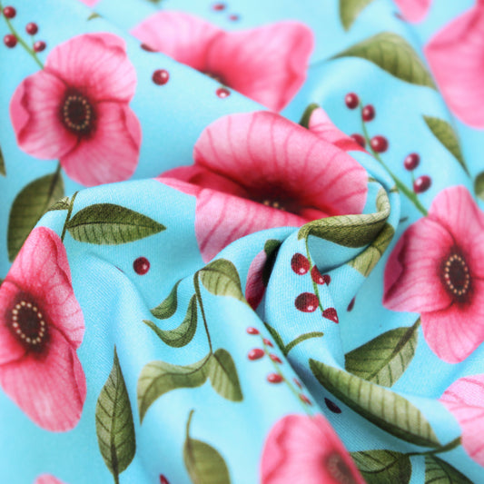 Tessuto in Raso di 100% Cotone: Fiori Rosa su sfondo Turchese
