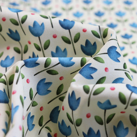 Tessuto in Raso di 100% Cotone: Tulipani Blu su sfondo Giallo Chiaro