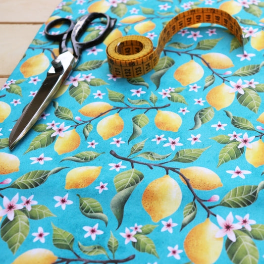 Tessuto in Raso di 100% Cotone: Limoni su sfondo Turchese