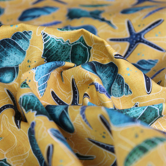 Tessuto in Raso di 100% Cotone: Conchiglie Blu su sfondo Giallo